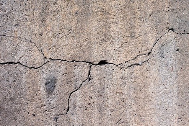 london house with cracked walls